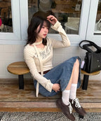 LETERIE LETTERING OFF-SHOULDER TIE LONG SLEEVE_IVORY