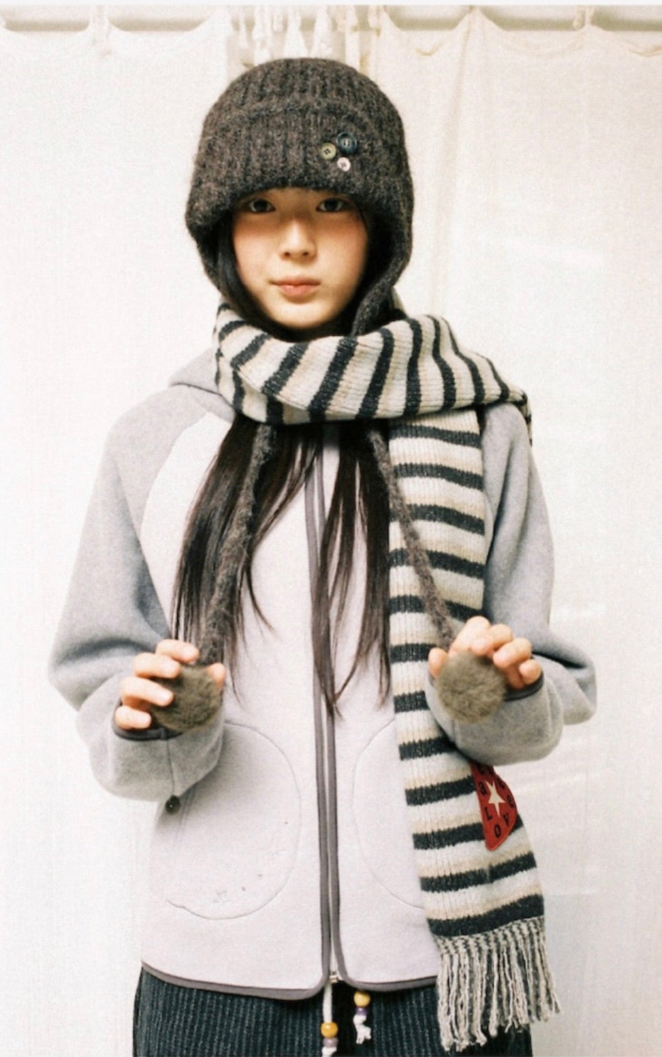 aeae STRIPE TASSEL MUFFLER [BROWN]