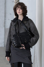 [DEINET] BELTED POCKET SHOULDER BAG IN BLACK