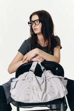 DEINET LOGO DUFFLE BAG IN GREY