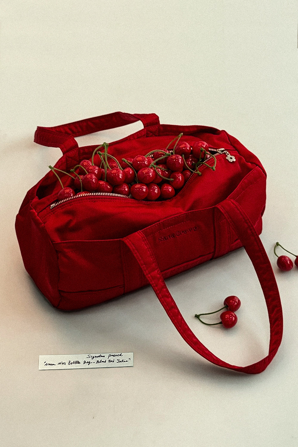 NANACREW MINI DUFFLE BAG - BLOOD RED SATIN